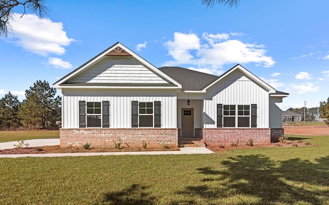 craftsman-style home with a front lawn