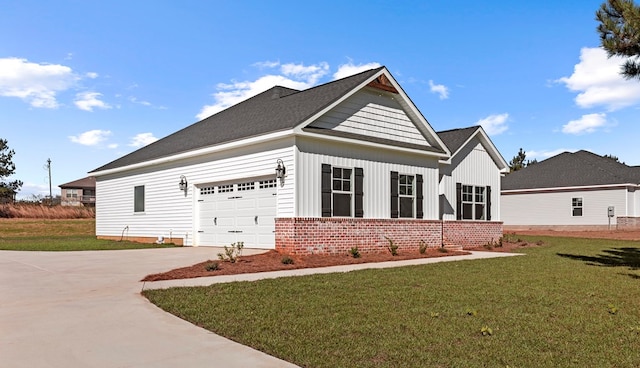 view of side of home with a lawn and a garage