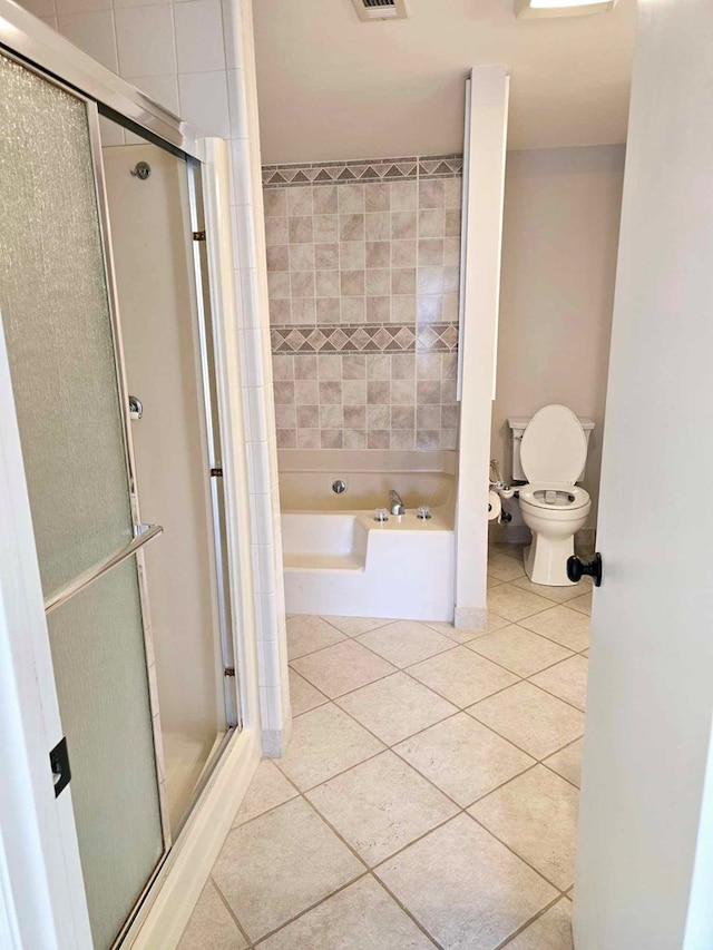 653 Honeysuckle Hills Rd, Ozark, AL 36360 - bathroom with toilet, tile patterned floors, a stall shower, and a tub to relax in