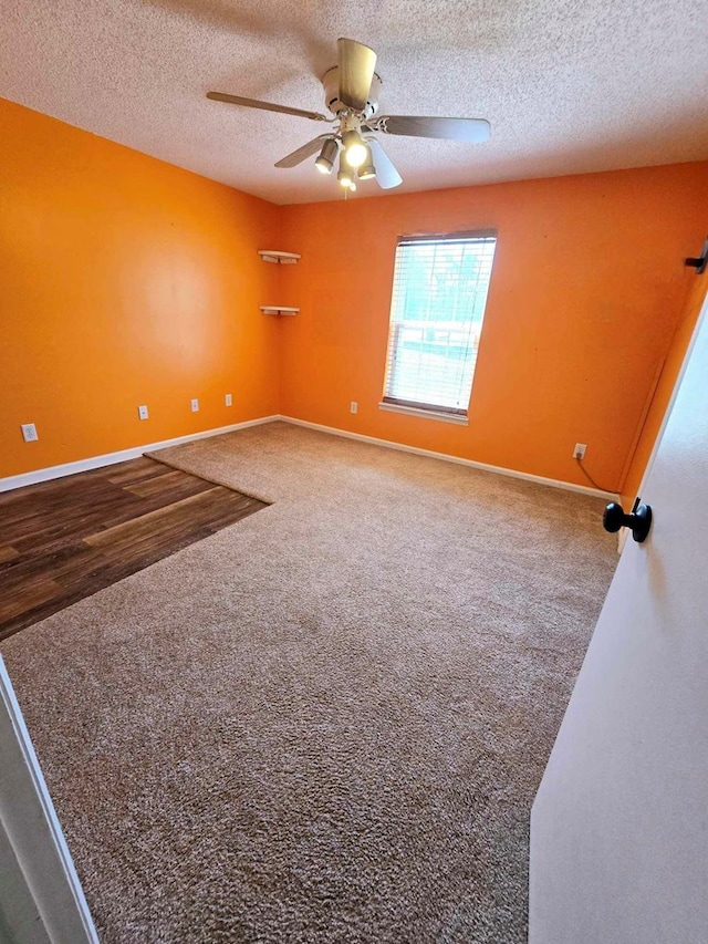 653 Honeysuckle Hills Rd, Ozark, AL 36360 - carpeted spare room with a textured ceiling, ceiling fan, and baseboards