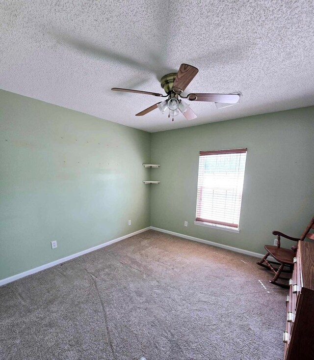 653 Honeysuckle Hills Rd, Ozark, AL 36360 - unfurnished room featuring a ceiling fan, carpet floors, baseboards, and a textured ceiling