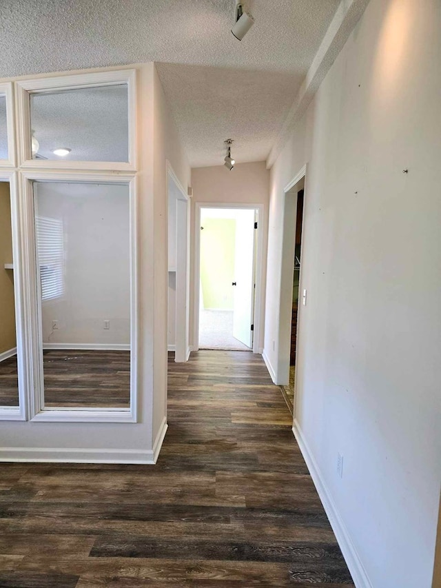 653 Honeysuckle Hills Rd, Ozark, AL 36360 - hall featuring a textured ceiling, wood finished floors, and baseboards
