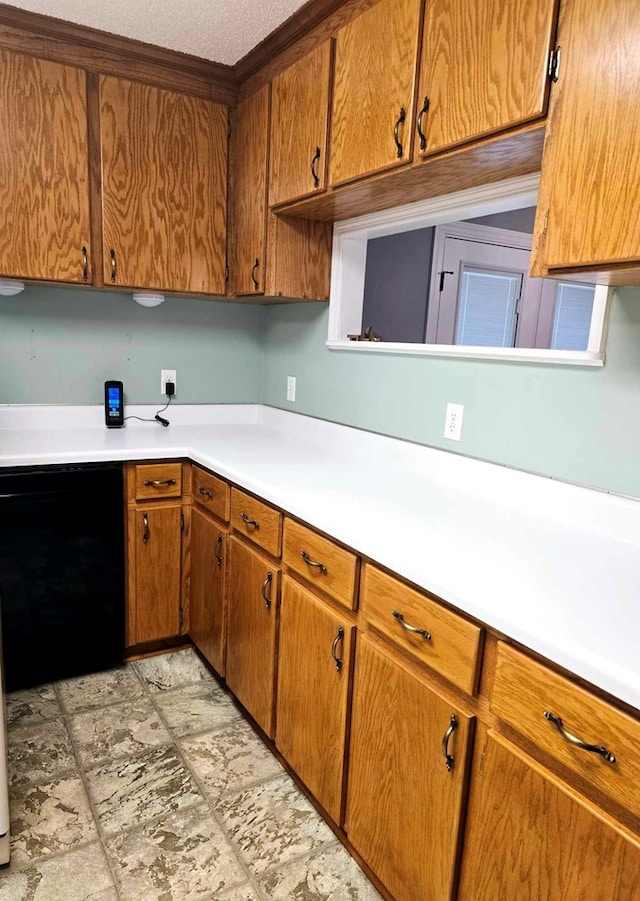 653 Honeysuckle Hills Rd, Ozark, AL 36360 - kitchen featuring light countertops and brown cabinets