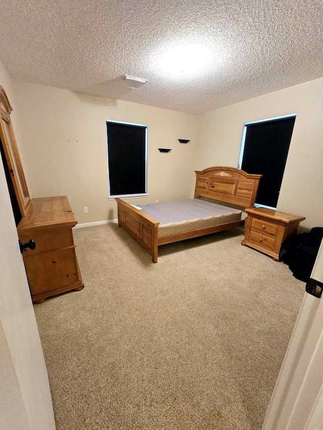 653 Honeysuckle Hills Rd, Ozark, AL 36360 - bedroom featuring carpet floors and a textured ceiling