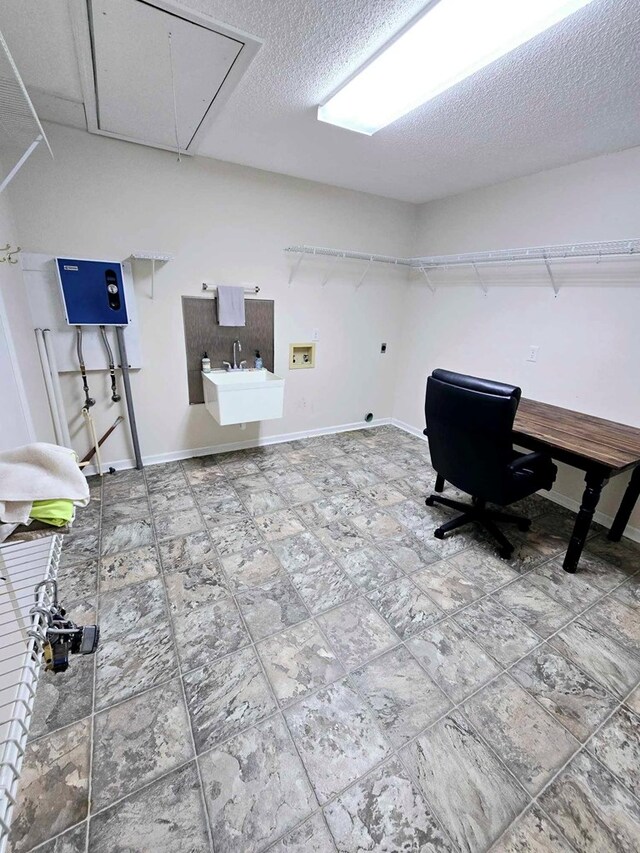 653 Honeysuckle Hills Rd, Ozark, AL 36360 - office space with attic access, a sink, a textured ceiling, and baseboards