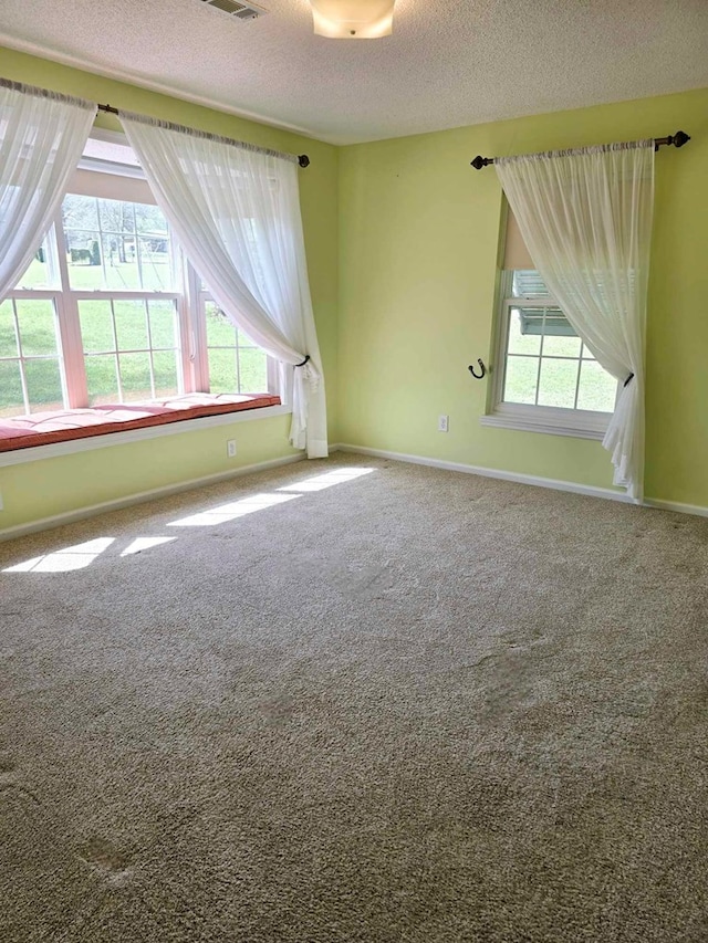 653 Honeysuckle Hills Rd, Ozark, AL 36360 - carpeted empty room featuring a textured ceiling and baseboards
