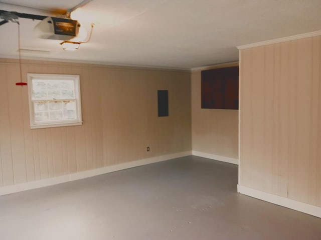 basement with electric panel and ornamental molding