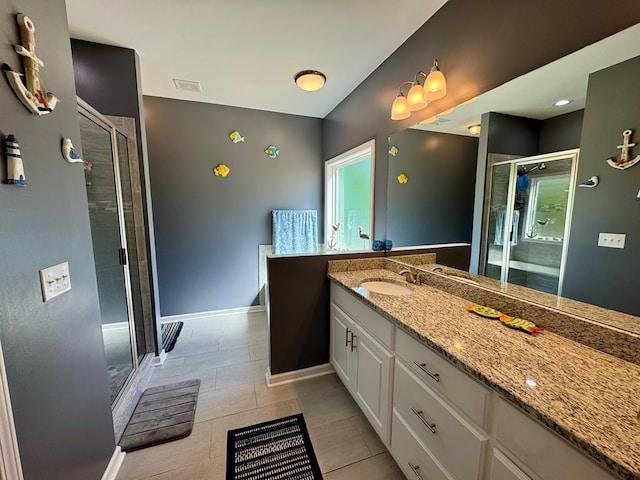 bathroom featuring a shower stall, baseboards, vanity, and visible vents