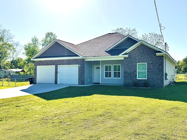 view of front of property with driveway, fence, brick siding, an attached garage, and a front yard
