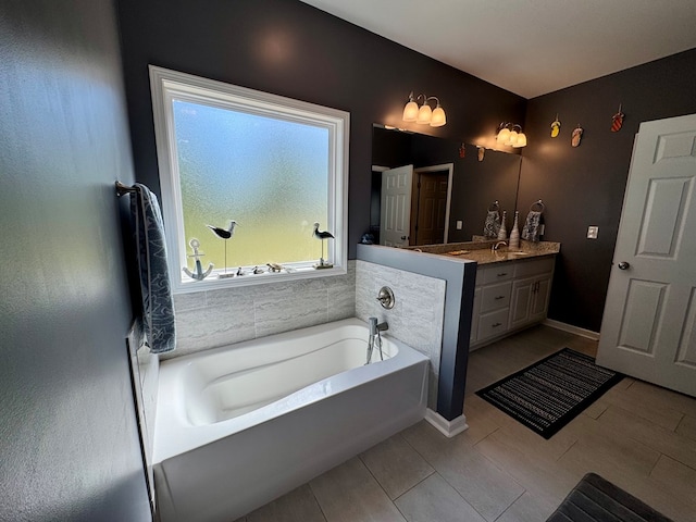 full bath featuring a bath, vanity, and wood finished floors