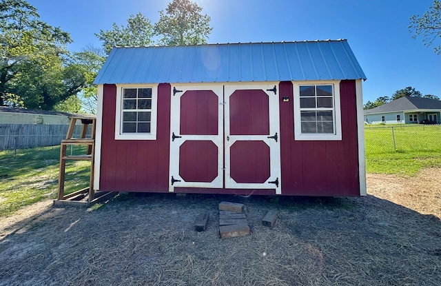 view of shed featuring a fenced backyard