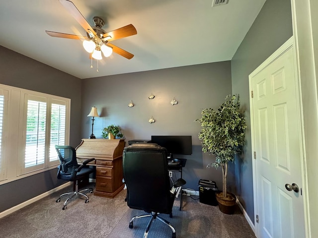 carpeted home office with visible vents, baseboards, and ceiling fan