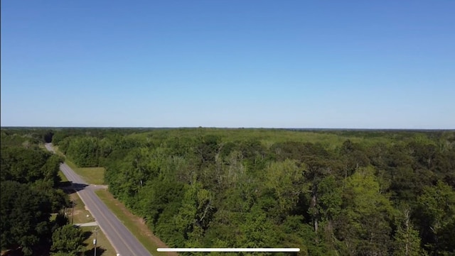 drone / aerial view with a view of trees