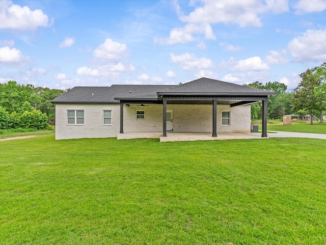 146 County Road 657, Chancellor, AL 36316 - rear view of house featuring a patio, a lawn, ceiling fan, and a shingled roof