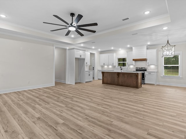 146 County Road 657, Chancellor, AL 36316 - kitchen featuring a raised ceiling, stainless steel electric range oven, open floor plan, crown molding, and recessed lighting