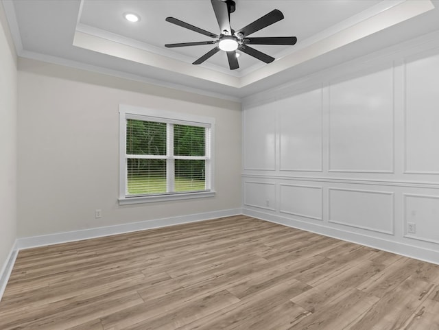 146 County Road 657, Chancellor, AL 36316 - unfurnished room featuring a raised ceiling, crown molding, light wood finished floors, a ceiling fan, and recessed lighting