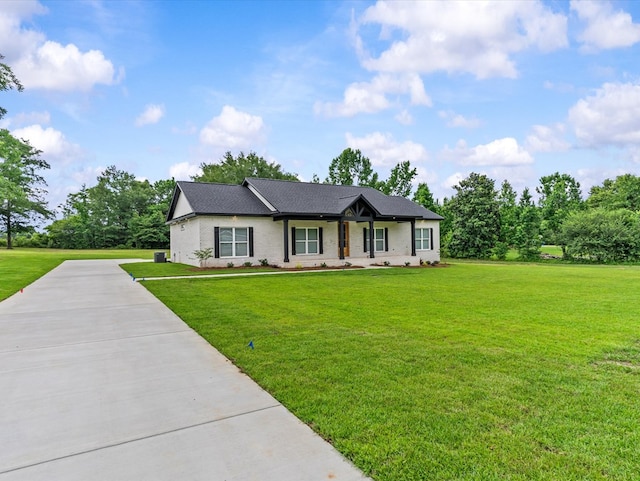 146 County Road 657, Chancellor, AL 36316 - single story home with a front lawn, brick siding, and a shingled roof