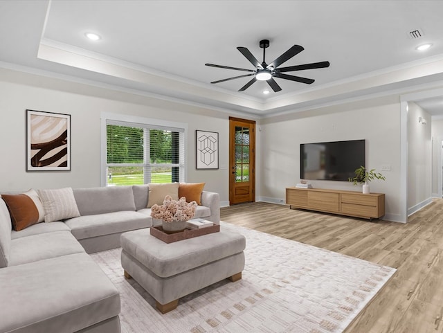 146 County Road 657, Chancellor, AL 36316 - living room featuring a tray ceiling, crown molding, light wood finished floors, ceiling fan, and recessed lighting