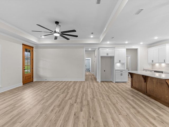146 County Road 657, Chancellor, AL 36316 - unfurnished living room featuring a raised ceiling, light wood finished floors, a ceiling fan, ornamental molding, and recessed lighting