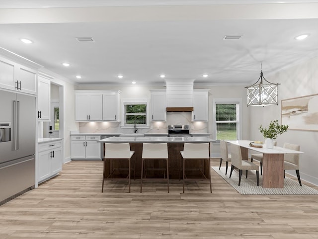 146 County Road 657, Chancellor, AL 36316 - kitchen featuring stainless steel appliances, light wood finished floors, white cabinets, plenty of natural light, and recessed lighting