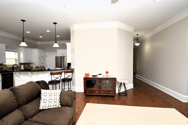 living area with recessed lighting, ornamental molding, baseboards, and dark wood-style floors
