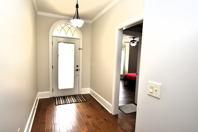 foyer entrance with baseboards, ornamental molding, a ceiling fan, and dark wood-style floors