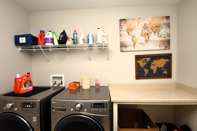 laundry room featuring washing machine and clothes dryer and laundry area