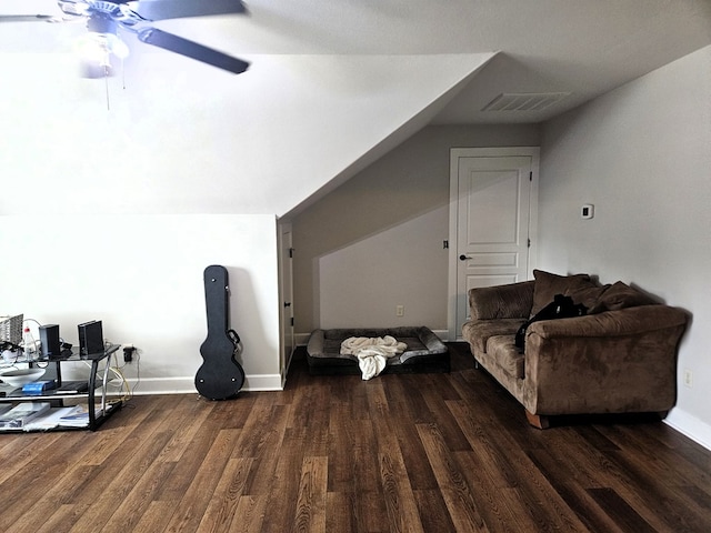 additional living space with a ceiling fan, baseboards, wood finished floors, vaulted ceiling, and visible vents