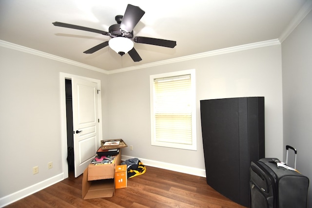 interior space with crown molding, baseboards, and wood finished floors