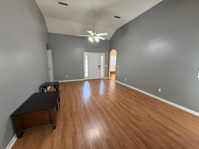 291 Nomad Cir, Kinsey, AL 36303 - entryway featuring a ceiling fan, light wood finished floors, arched walkways, and high vaulted ceiling