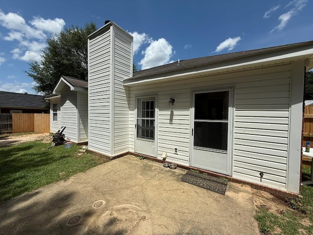 291 Nomad Cir, Kinsey, AL 36303 - rear view of house with a patio area and a chimney