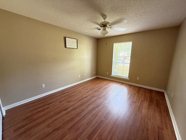 291 Nomad Cir, Kinsey, AL 36303 - unfurnished room with a ceiling fan, dark wood-type flooring, and a textured ceiling