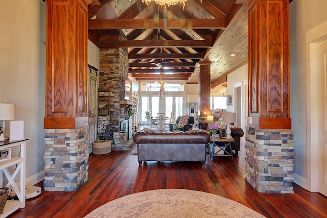 living room with high vaulted ceiling, ornate columns, a notable chandelier, beam ceiling, and dark hardwood / wood-style flooring