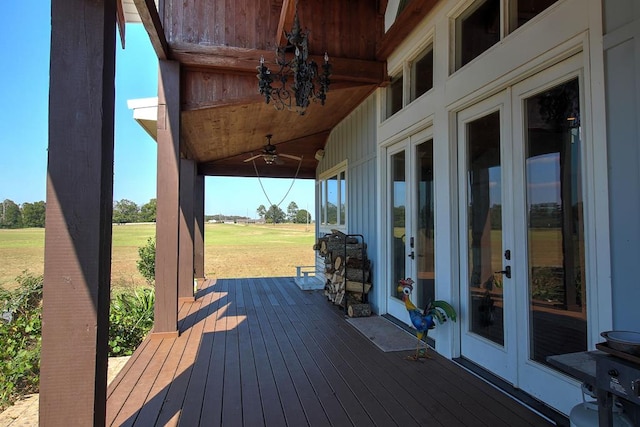 wooden terrace with french doors and ceiling fan