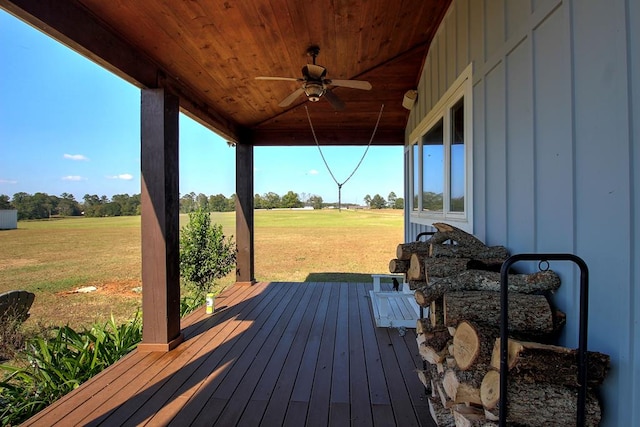 deck featuring a yard and ceiling fan