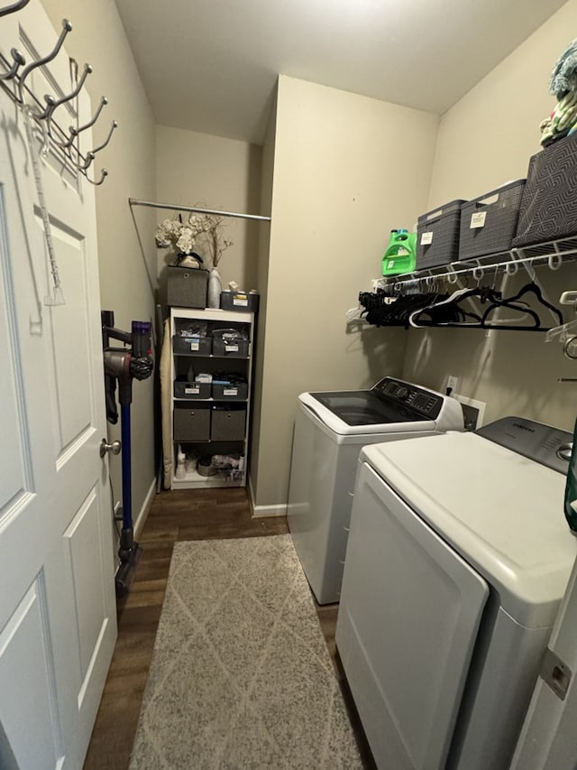 laundry room featuring dark wood-type flooring and washing machine and clothes dryer