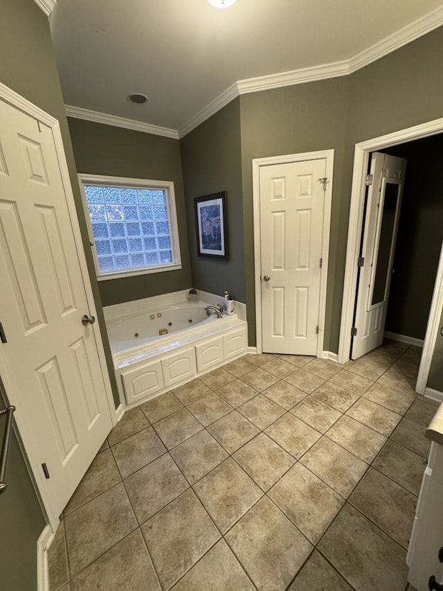 bathroom with tile patterned floors, a bath, and ornamental molding