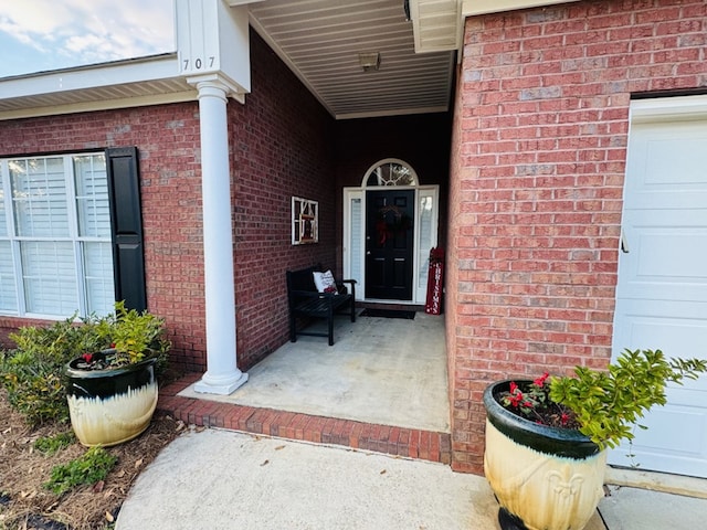 view of exterior entry featuring a garage