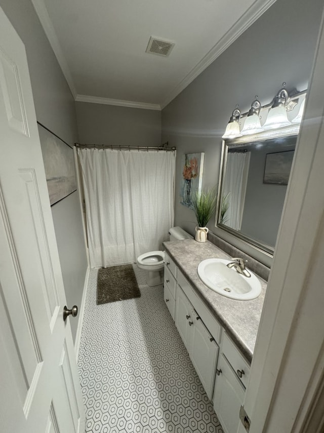 bathroom featuring toilet, vanity, a shower with shower curtain, and ornamental molding