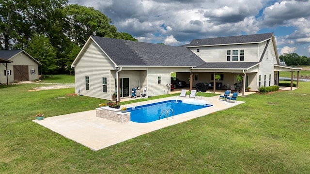 208 Reardon, Rehobeth, AL 36301 - back of house featuring a patio area, an outdoor pool, a yard, and roof with shingles