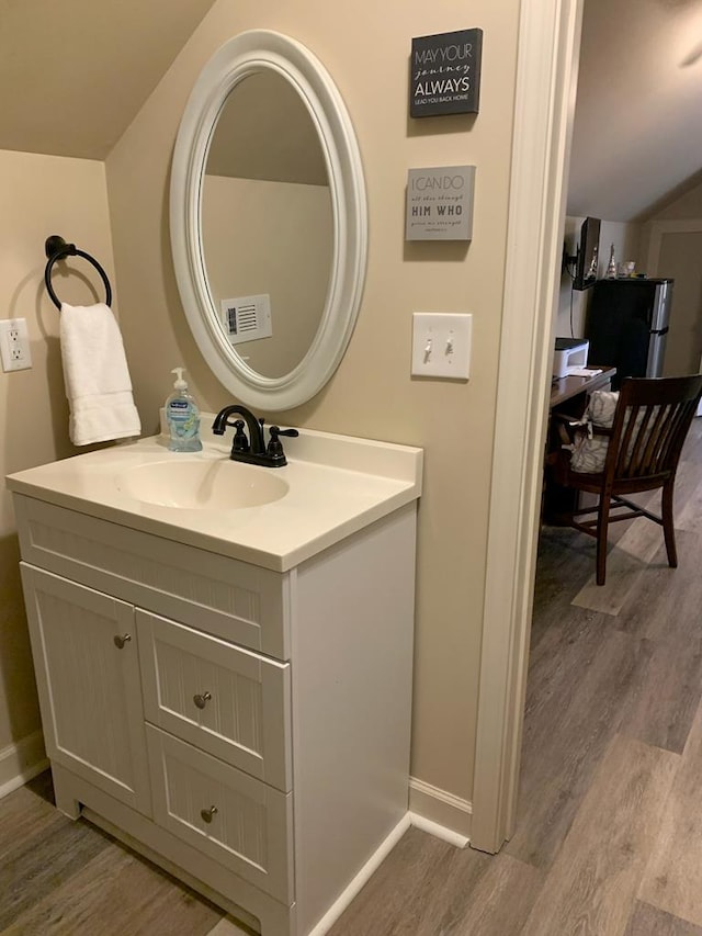 208 Reardon, Rehobeth, AL 36301 - bathroom with wood finished floors, vanity, and baseboards