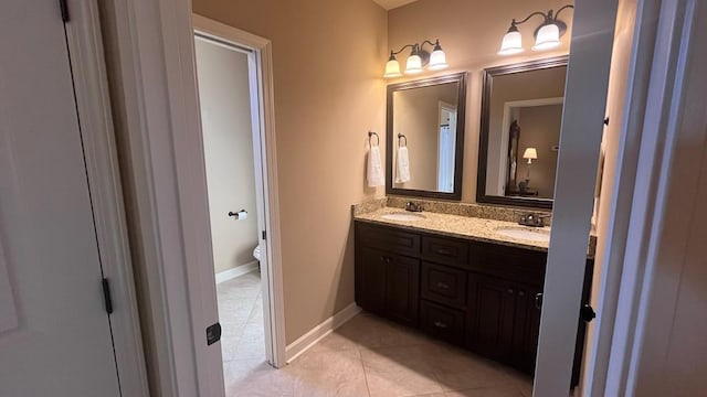 208 Reardon, Rehobeth, AL 36301 - full bathroom featuring double vanity, tile patterned flooring, toilet, and baseboards
