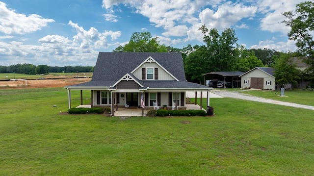 208 Reardon, Rehobeth, AL 36301 - view of front facade featuring a front lawn, driveway, covered porch, a detached carport, and a shingled roof