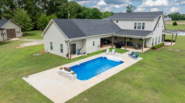208 Reardon, Rehobeth, AL 36301 - rear view of property with a lawn, a patio, a shingled roof, and an outdoor pool
