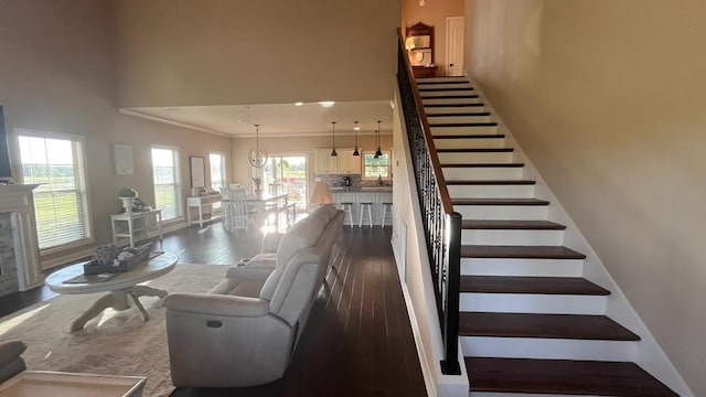 208 Reardon, Rehobeth, AL 36301 - stairs with wood finished floors, a high ceiling, crown molding, a chandelier, and baseboards