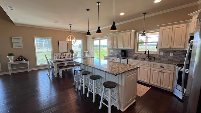 208 Reardon, Rehobeth, AL 36301 - kitchen featuring a sink, tasteful backsplash, white cabinetry, dark wood finished floors, and light stone counters