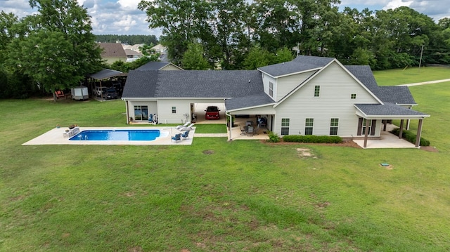 208 Reardon, Rehobeth, AL 36301 - rear view of property with a patio area, a lawn, roof with shingles, and an outdoor pool