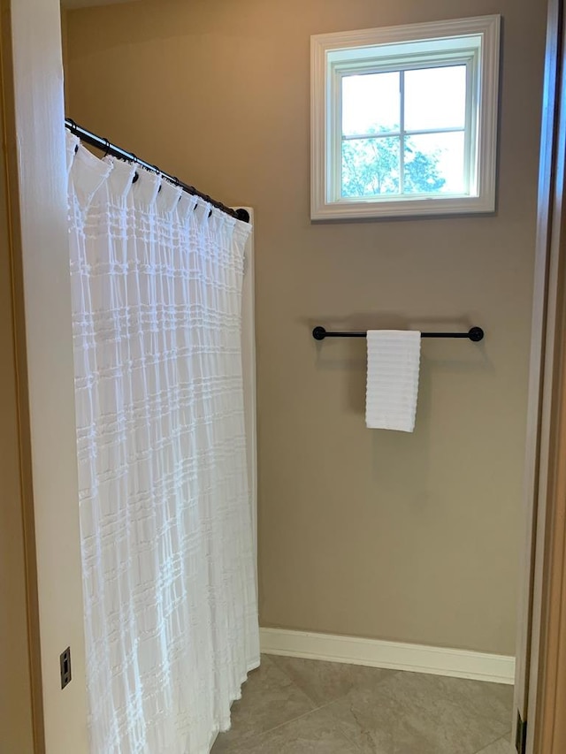 208 Reardon, Rehobeth, AL 36301 - bathroom with baseboards, curtained shower, and tile patterned floors