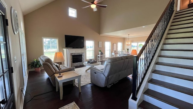 208 Reardon, Rehobeth, AL 36301 - living area featuring stairs, a fireplace, dark wood-type flooring, a high ceiling, and ceiling fan