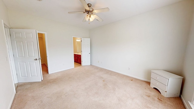 106 Whitney Ave, Enterprise, AL 36330 - unfurnished bedroom with light carpet, baseboards, connected bathroom, and ceiling fan